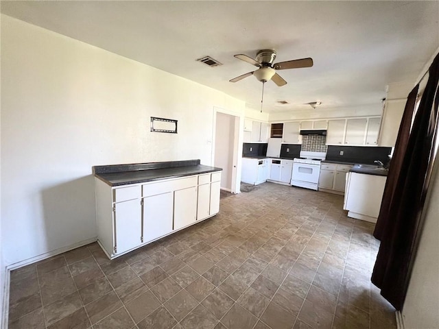 kitchen with white range with electric stovetop, white cabinets, visible vents, and dark countertops