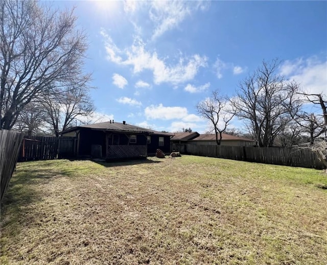 view of yard with a fenced backyard