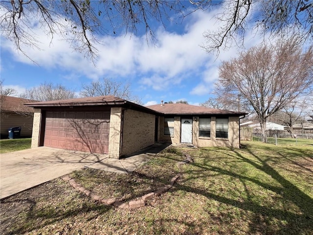 view of front of property with driveway, an attached garage, fence, a front lawn, and brick siding