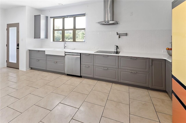 kitchen featuring gray cabinetry, dishwasher, wall chimney range hood, sink, and black electric cooktop