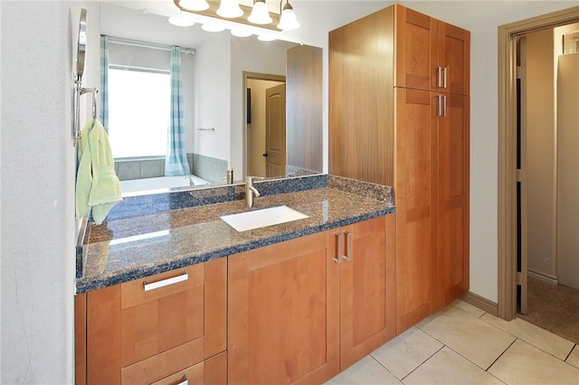 bathroom with tile patterned flooring and vanity