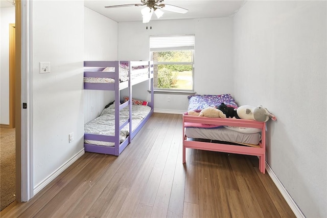 bedroom with wood-type flooring and ceiling fan