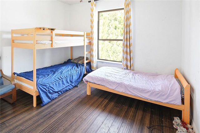 bedroom with hardwood / wood-style floors