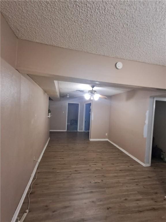 1202 Cheyenne Dr, Brenham, TX 77833 - finished below grade area with wood finished floors and a textured ceiling