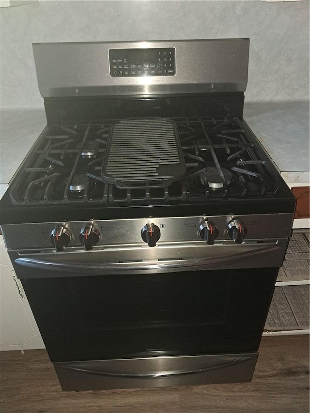 1202 Cheyenne Dr, Brenham, TX 77833 - kitchen view of stainless steel gas stove and wood finished floors