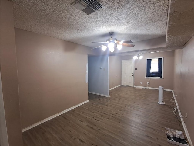 1202 Cheyenne Dr, Brenham, TX 77833 - spare room with a textured ceiling, a ceiling fan, and wood finished floors
