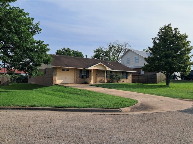 1202 Cheyenne Dr, Brenham, TX 77833 - single story home featuring a garage, brick siding, and concrete driveway