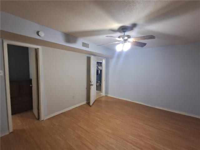 1202 Cheyenne Dr, Brenham, TX 77833 - unfurnished room with light wood finished floors, a ceiling fan, and a smoke detector