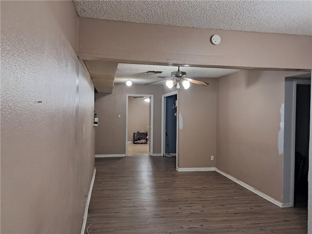 1202 Cheyenne Dr, Brenham, TX 77833 - unfurnished room with wood finished floors, a textured ceiling, ceiling fan, and a smoke detector