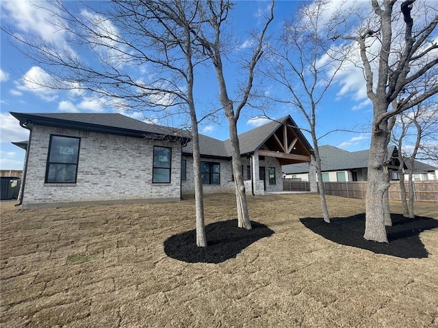 rear view of property featuring a patio area