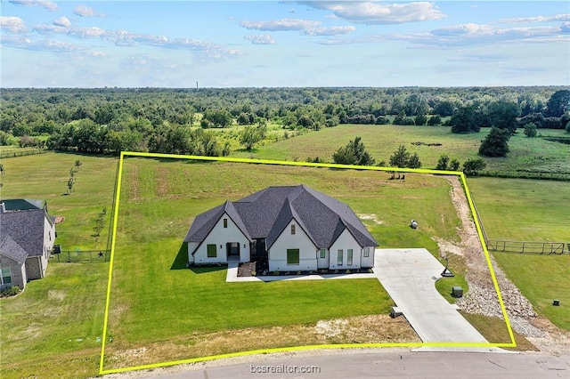 birds eye view of property with a rural view