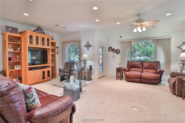 living room featuring ceiling fan and light colored carpet