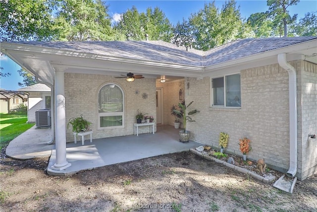 entrance to property with a patio, central AC unit, and ceiling fan