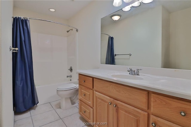 full bathroom featuring tile patterned flooring, vanity, toilet, and shower / bath combo with shower curtain