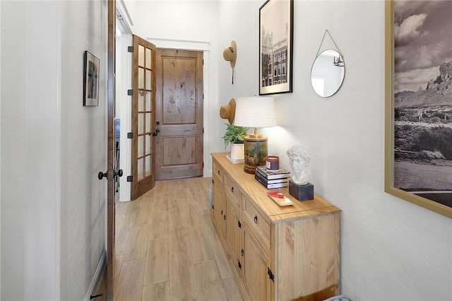 hallway featuring light wood-style flooring