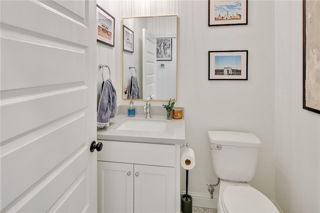 bathroom with toilet and vanity