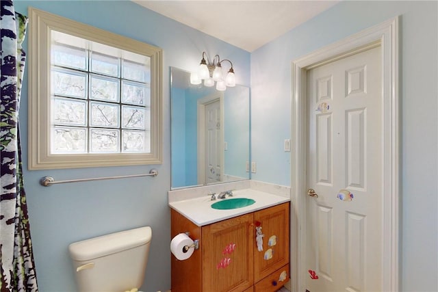 bathroom with vanity and toilet