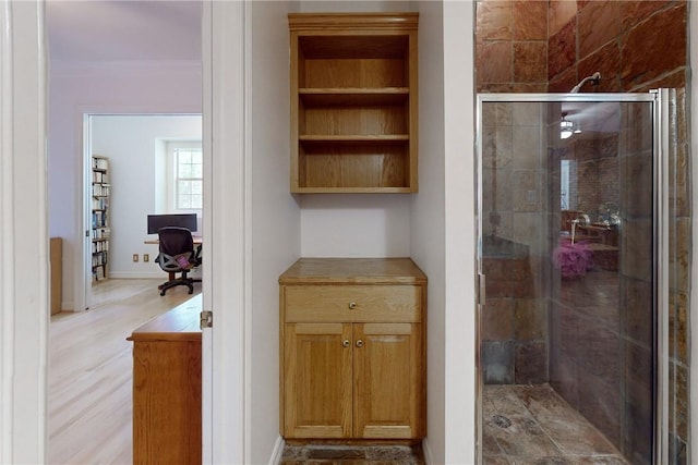 bathroom featuring an enclosed shower