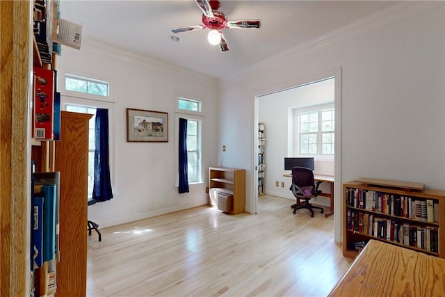 interior space with ceiling fan, light wood-type flooring, and crown molding