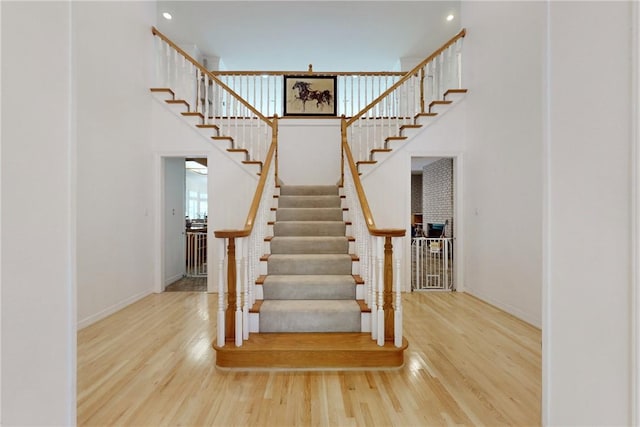 stairs featuring hardwood / wood-style flooring