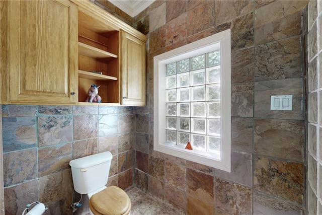 bathroom with toilet and ornamental molding