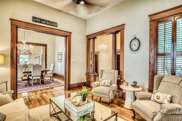 402 Ross St, Brenham, TX 77833 - living area featuring a chandelier, hardwood / wood-style flooring, ceiling fan, and baseboards