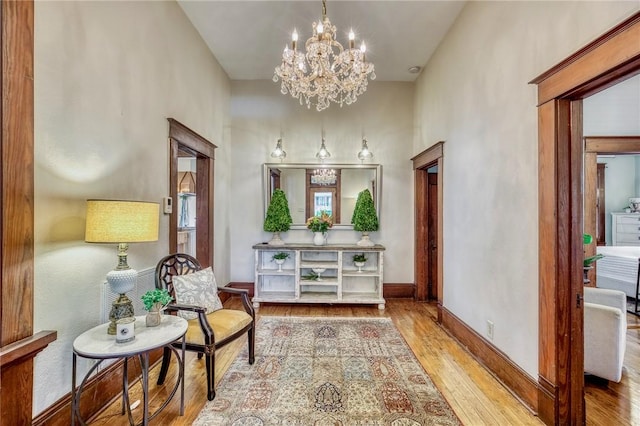 402 Ross St, Brenham, TX 77833 - sitting room with a chandelier, wood finished floors, and baseboards