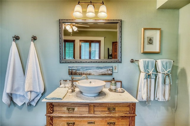 402 Ross St, Brenham, TX 77833 - bathroom with crown molding, vanity, and a ceiling fan