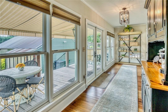 402 Ross St, Brenham, TX 77833 - entryway featuring crown molding, wood finished floors, a chandelier, and french doors