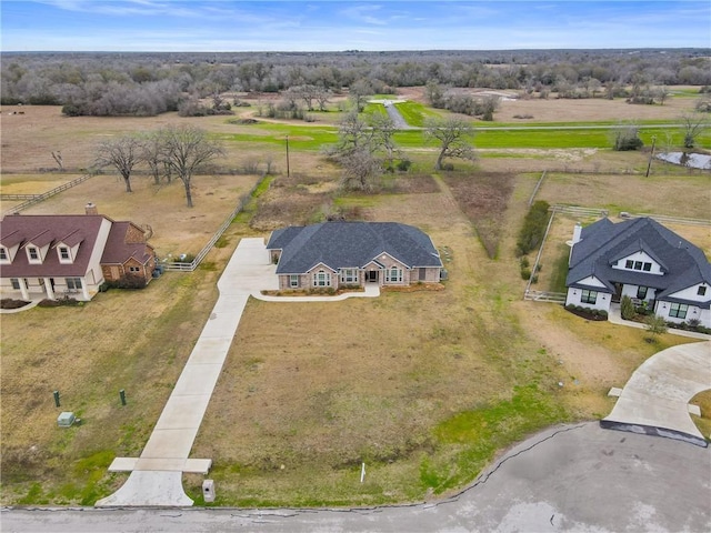 birds eye view of property featuring a rural view