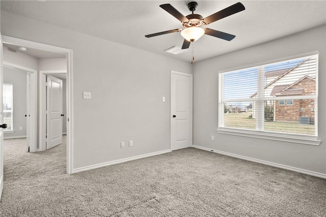 empty room with light carpet and ceiling fan