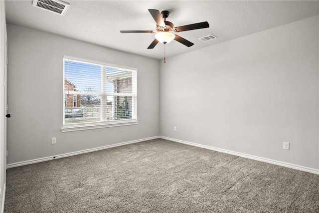 carpeted spare room with ceiling fan