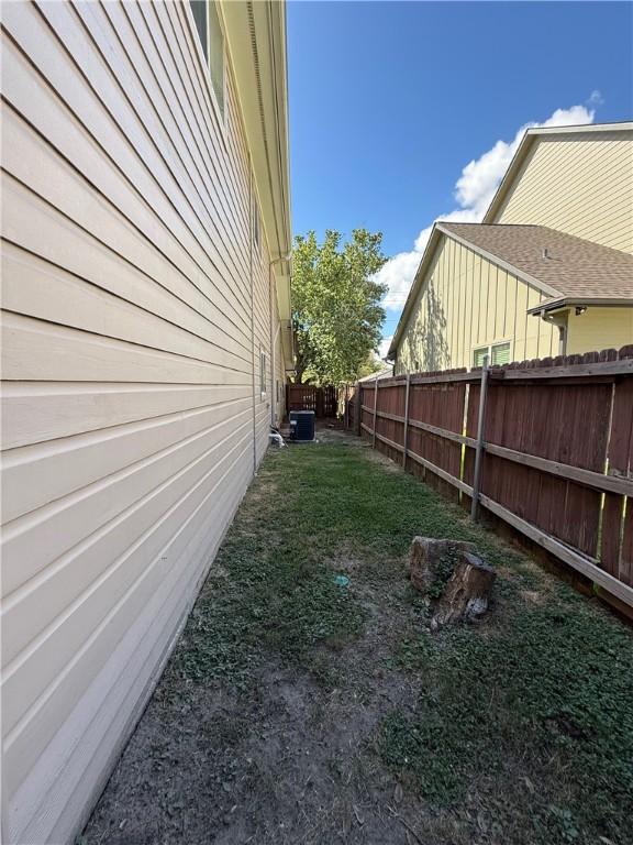 view of yard with central AC