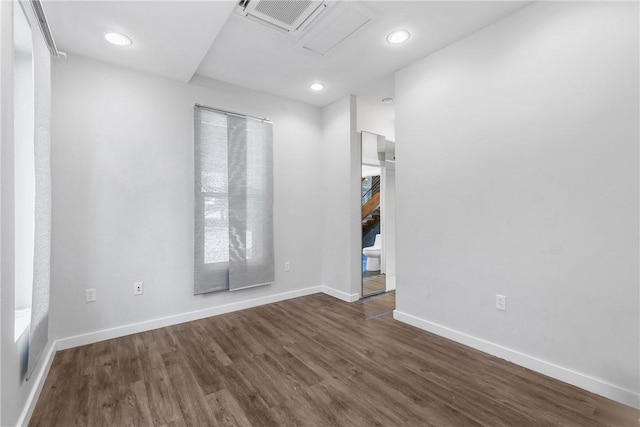 213 N Houston Ave, Bryan, TX 77803 - spare room featuring dark wood-type flooring and recessed lighting