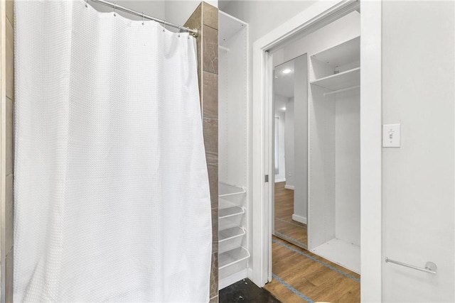 213 N Houston Ave, Bryan, TX 77803 - bathroom with wood finished floors and a shower with curtain