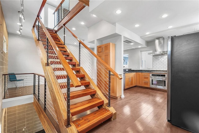 213 N Houston Ave, Bryan, TX 77803 - staircase with wood finished floors and recessed lighting