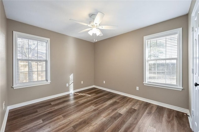 unfurnished room with dark hardwood / wood-style floors and ceiling fan