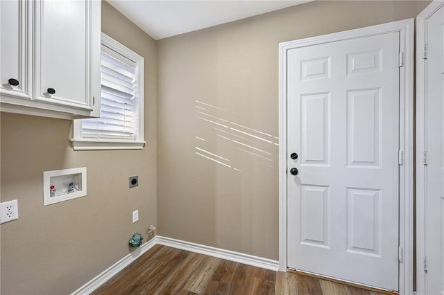 washroom with electric dryer hookup, dark hardwood / wood-style flooring, cabinets, and washer hookup