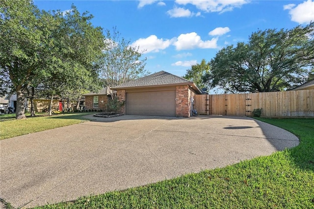 view of front of house with a front lawn and a garage