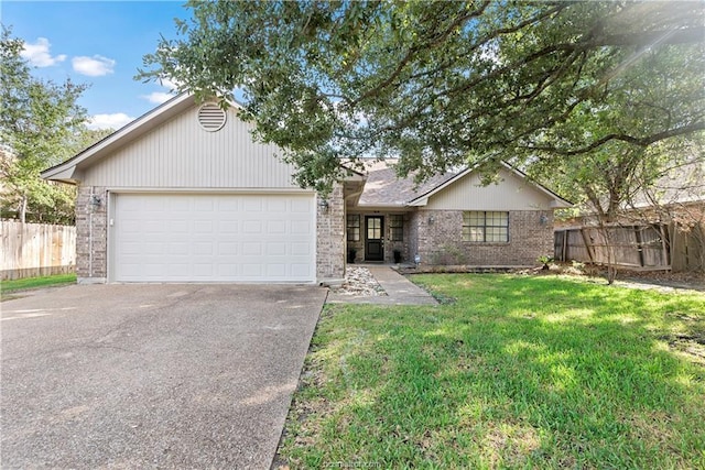 2811 Arroyo Ct N, College Station, TX 77845 - ranch-style house featuring brick siding, asphalt driveway, and an attached garage