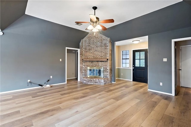 2811 Arroyo Ct N, College Station, TX 77845 - unfurnished living room featuring ceiling fan, wood finished floors, baseboards, lofted ceiling, and a brick fireplace