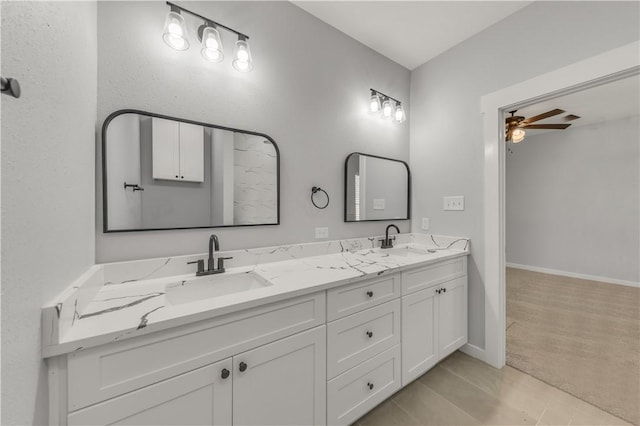 bathroom featuring ceiling fan and vanity