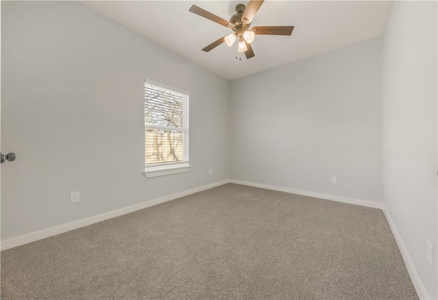 spare room featuring carpet floors and ceiling fan