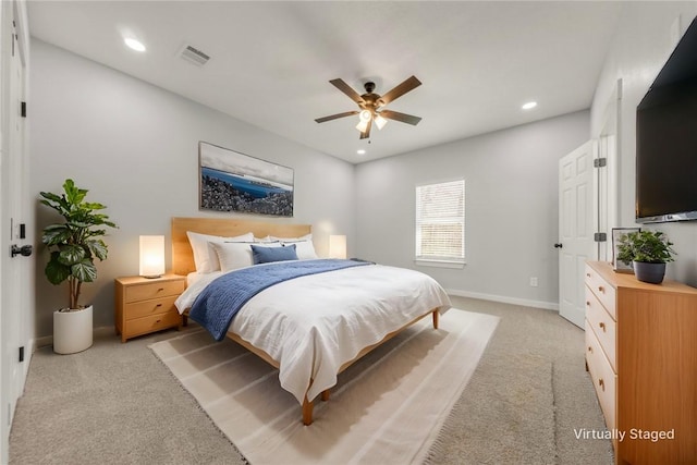 carpeted bedroom with ceiling fan