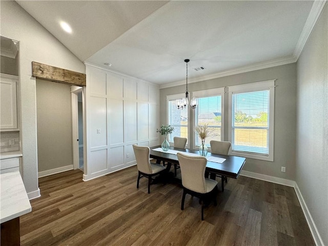 dining room featuring crown molding, dark wood-type flooring, vaulted ceiling, and an inviting chandelier