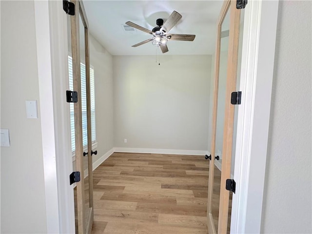 spare room featuring ceiling fan and light hardwood / wood-style floors