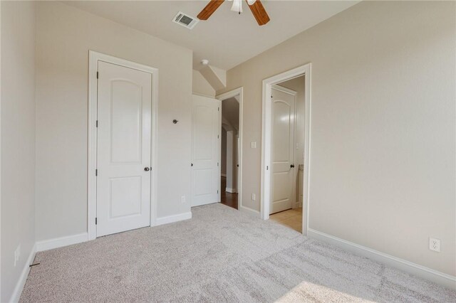 15613 Wood Brook Ln, College Station, TX 77845 - unfurnished bedroom featuring light carpet and a ceiling fan