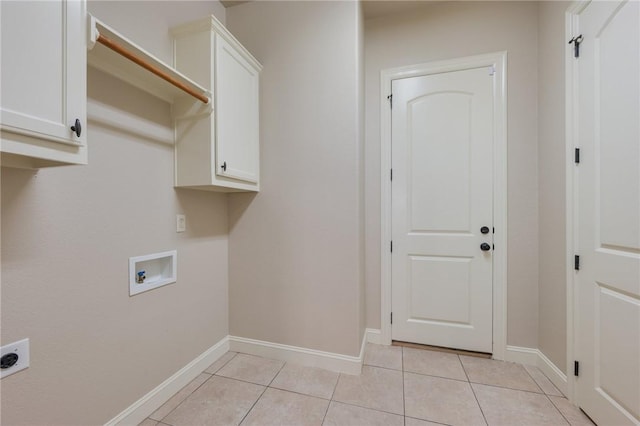 15613 Wood Brook Ln, College Station, TX 77845 - laundry area with cabinet space, light tile patterned floors, washer hookup, and electric dryer hookup