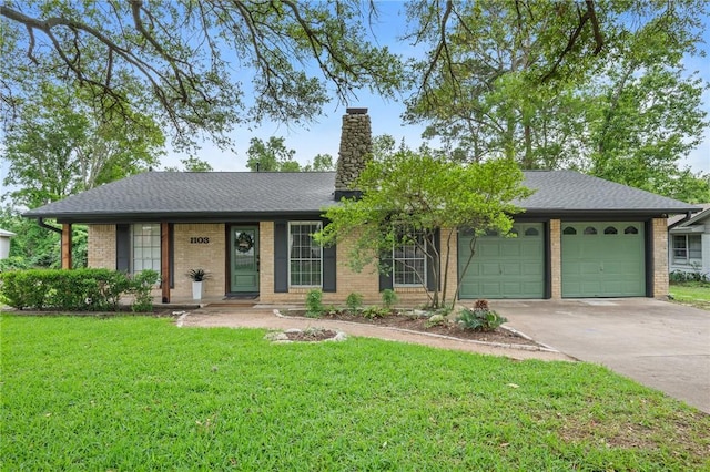 single story home featuring a front lawn, brick siding, a garage, a chimney, and concrete driveway