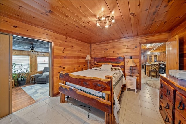 bedroom featuring wooden ceiling, light tile patterned floors, and wood walls